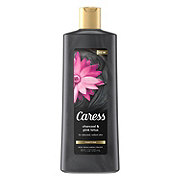 https://images.heb.com/is/image/HEBGrocery/prd-small/caress-purifying-charcoal-pink-lotus-body-wash-003367080.jpg