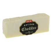 https://images.heb.com/is/image/HEBGrocery/prd-small/h-e-b-deli-artisan-aged-white-cheddar-cheese-001109287.jpg