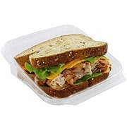 https://images.heb.com/is/image/HEBGrocery/prd-small/h-e-b-meal-simple-turkey-with-sundried-tomato-and-medium-cheddar-cheese-sandwich-001415044.jpg