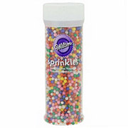 https://images.heb.com/is/image/HEBGrocery/prd-small/wilton-jumbo-rainbow-nonpareils-sprinkles-001076443.jpg