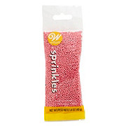 https://images.heb.com/is/image/HEBGrocery/prd-small/wilton-sprinkles-pink-nonpareils-002964567.jpg